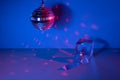 Glass prisms and a ball in colored light