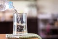 The Glass of the purified water on the table bar in kitchenroom Royalty Free Stock Photo