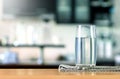 Glass of purified water on table bar in kitchenroom Royalty Free Stock Photo