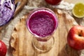 A glass of purple cabbage juice with red cabbage and fresh fruit Royalty Free Stock Photo