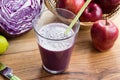 A glass of purple cabbage juice on a table Royalty Free Stock Photo