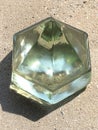 Glass pyramid sitting on cement