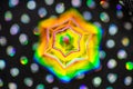 Glass rainbow hexagon with polka dot background