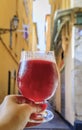 Glass of a raspberry Lambic ale at an outdoor restaurant in old town Nice France