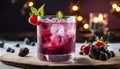 A glass of raspberry lemonade with berries on a cutting board Royalty Free Stock Photo