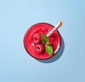 Glass of raspberry smoothie on blue background Royalty Free Stock Photo