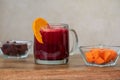 Glass with red beet and carrot juice