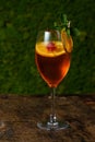 Glass of red cocktail with orange slice and cherry Royalty Free Stock Photo