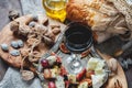 A glass of red dry wine and Focaccia Italian bread with cheese and olive oil, sun-dried tomatoes and different kinds of nuts . Sel Royalty Free Stock Photo