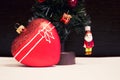 Glass red heart and Christmas decorative Christmas tree. Beautiful New Year Decorations. Royalty Free Stock Photo