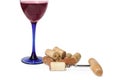 Glass of red sparkling wine near pile of corks and corkscrew Royalty Free Stock Photo