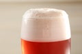 Glass of red tasty beer with foam Royalty Free Stock Photo