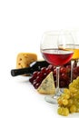 Glass of red and white wine, cheeses and grapes isolated on a white Royalty Free Stock Photo
