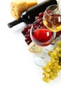 Glass of red and white wine, cheeses and grapes isolated on a white