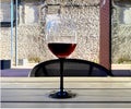 Glass of red wine against a brick wall in urban city restaurant house design art relaxing  lifestyle Royalty Free Stock Photo