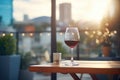 a glass of red wine on a balcony overlooking the city Royalty Free Stock Photo