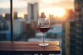 a glass of red wine on a balcony overlooking the city Royalty Free Stock Photo