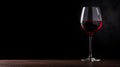 Glass of red wine on a black background with copy space Royalty Free Stock Photo