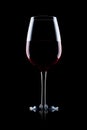 Glass of red wine on black with reflection Royalty Free Stock Photo