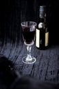 Glass of red wine on a black velvet background, close-up Royalty Free Stock Photo