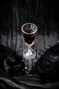 Glass of red wine on a black velvet background, close-up Royalty Free Stock Photo