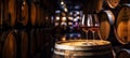 Glass of red wine with a blurred background of cellar, wine-vault with barrels. Generative AI