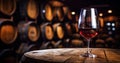 Glass of red wine with a blurred background of cellar, wine-vault with barrels. Generative AI