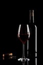 Glass of red wine, bottle and corkscrew Royalty Free Stock Photo