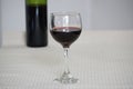 Glass of red wine and bottle Royalty Free Stock Photo