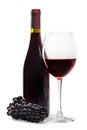 Glass of red wine bottle and fresh grapes on a white background Royalty Free Stock Photo
