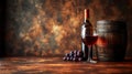A glass of red wine, a bottle, grapes and a barrel on a background in brown tones. Copy space. Royalty Free Stock Photo