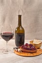 Glass of red wine, bottle and pairing foods Royalty Free Stock Photo