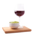 Glass of red wine and bowl of grapes Royalty Free Stock Photo