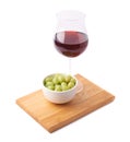 Glass of red wine and bowl of grapes Royalty Free Stock Photo