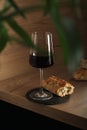A glass of wine with bread in minimalistic style