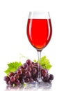 Glass of red wine and a bunch of ripe grapes isolated Royalty Free Stock Photo