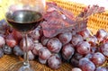 Glass of red wine with bunches of ripe grapes Royalty Free Stock Photo