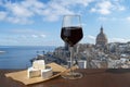 Glass of red wine with cheese with view of Valletta old town and harbor in Valletta, Malta