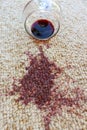 Glass of red wine fell on carpet Royalty Free Stock Photo