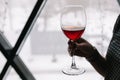 A glass of  red wine in a female hand Royalty Free Stock Photo