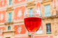 Glass of red wine in front of the episcopal palace in Murcia Royalty Free Stock Photo