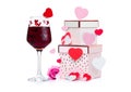 Glass of red wine with heart and pink gift box Royalty Free Stock Photo