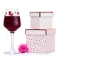 Glass of red wine with heart and pink gift box Royalty Free Stock Photo