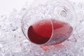 Glass of red wine on the ice cubes Royalty Free Stock Photo