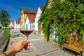 Glass of red wine with many colorful old traditional wine cellers in Villanykovesd in a hungarian wine region called Royalty Free Stock Photo