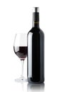 Glass of red wine next to a bottle isolated on white background Royalty Free Stock Photo