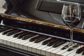 Glass of red wine on piano keyboard. Music and wine concept Royalty Free Stock Photo