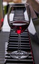 Glass of red wine on piano keyboard. Music and wine concept Royalty Free Stock Photo