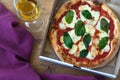 Glass of red wine with pizza on cutting board Royalty Free Stock Photo