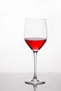 Glass of red wine with reflection Royalty Free Stock Photo